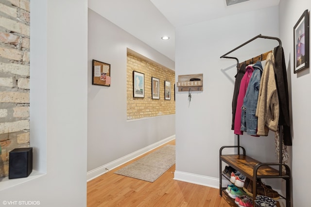 hallway featuring wood-type flooring