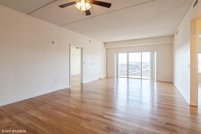 unfurnished room featuring ceiling fan and light hardwood / wood-style flooring