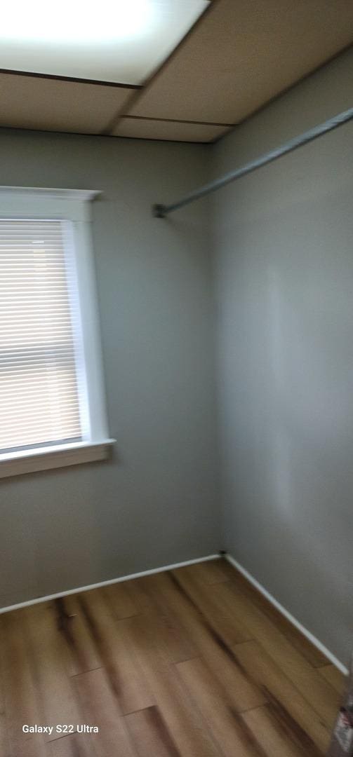 8350 S Muskegon Ave, Chicago, IL 60617 - spare room featuring wood finished floors and baseboards