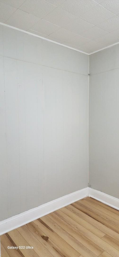 8350 S Muskegon Ave, Chicago, IL 60617 - unfurnished room with light wood-style flooring and baseboards