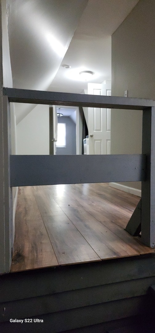 basement featuring hardwood / wood-style floors