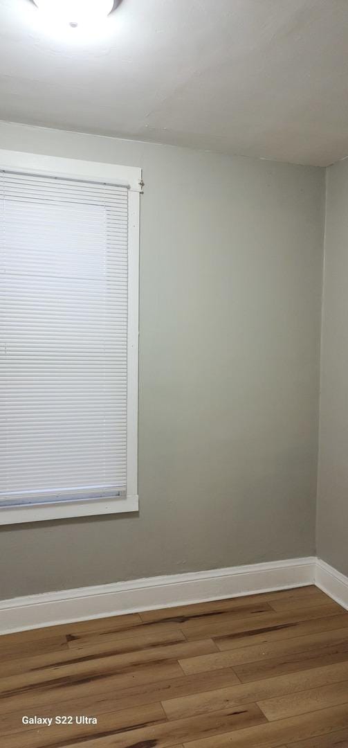8350 S Muskegon Ave, Chicago, IL 60617 - empty room with wood finished floors and baseboards