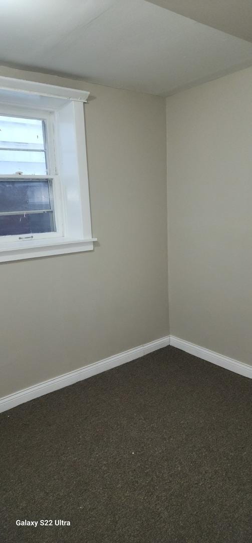 8350 S Muskegon Ave, Chicago, IL 60617 - unfurnished room featuring dark carpet and baseboards