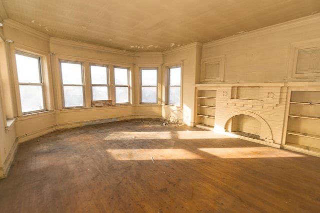 7351 S Indiana Ave, Chicago, IL 60619 - unfurnished living room with crown molding, plenty of natural light, wood finished floors, baseboards, and wood ceiling