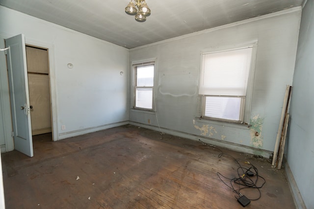 unfurnished room with crown molding and dark wood-type flooring