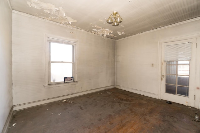 7351 S Indiana Ave, Chicago, IL 60619 - spare room with concrete floors and a chandelier