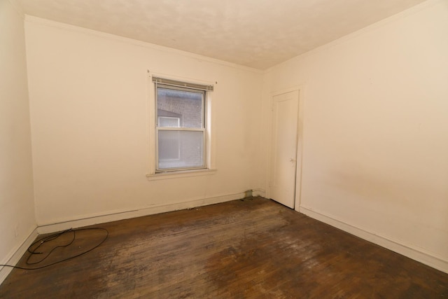7351 S Indiana Ave, Chicago, IL 60619 - spare room featuring ornamental molding, dark wood-style flooring, and baseboards