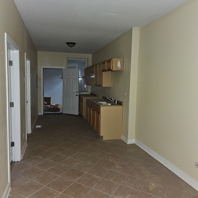 kitchen with sink and tile patterned flooring