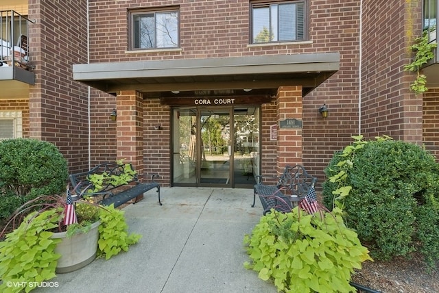 entrance to property featuring french doors and a patio area