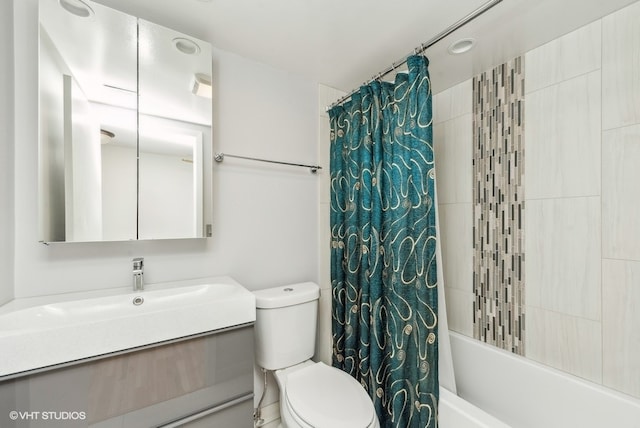 full bathroom with shower / tub combo, vanity, and toilet