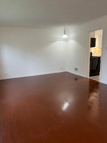 unfurnished room featuring wood-type flooring