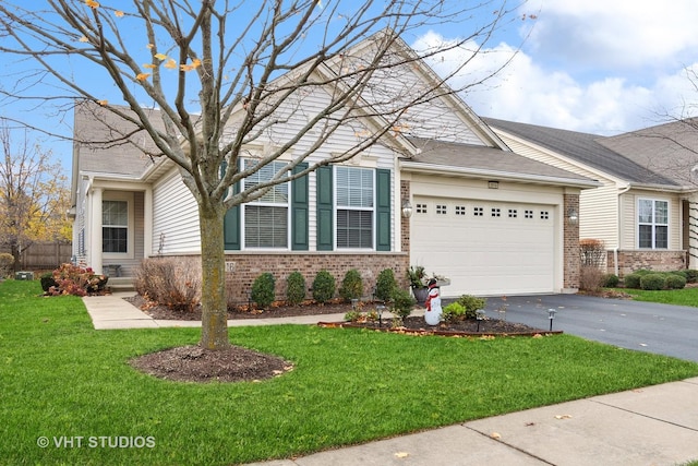 view of front of home featuring a garage and a front yard