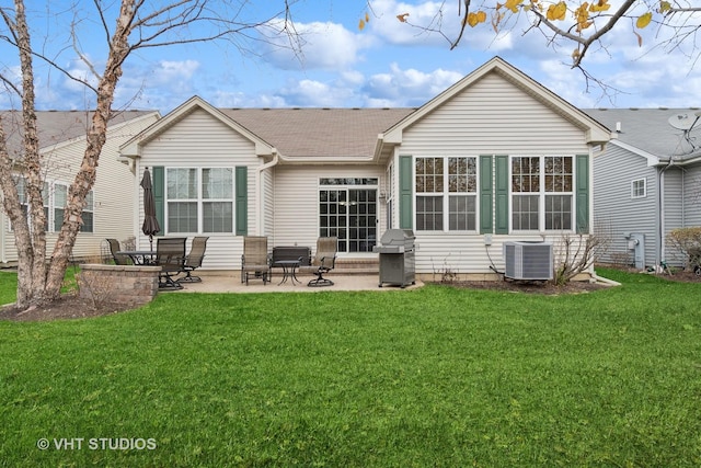 back of house featuring a patio area, a yard, and central air condition unit