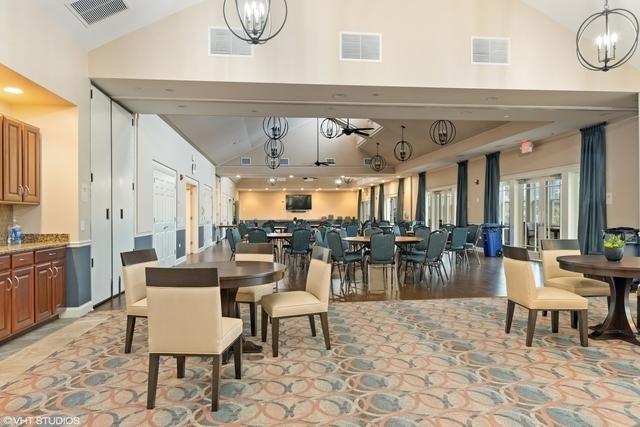 dining area with vaulted ceiling and an inviting chandelier