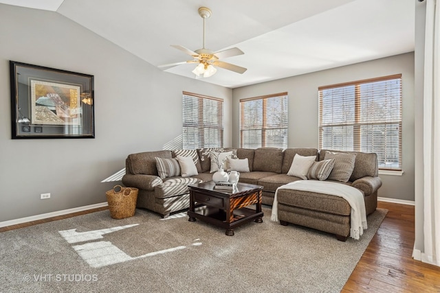 living room featuring vaulted ceiling, ceiling fan, and wood-type flooring