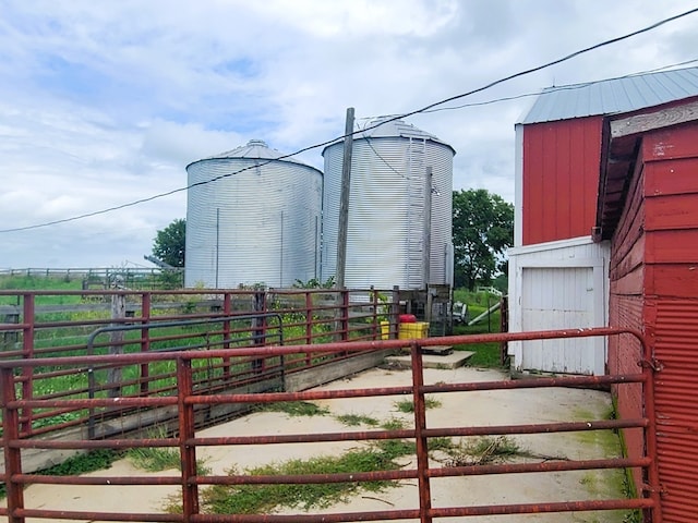 view of gate with an outbuilding