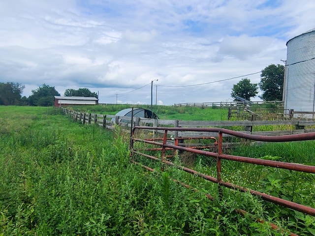 view of yard with a rural view