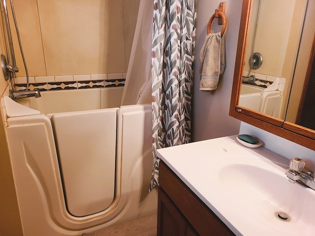 bathroom with vanity and shower / bath combo with shower curtain