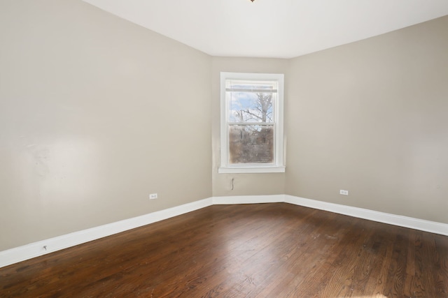 unfurnished room with hardwood / wood-style flooring