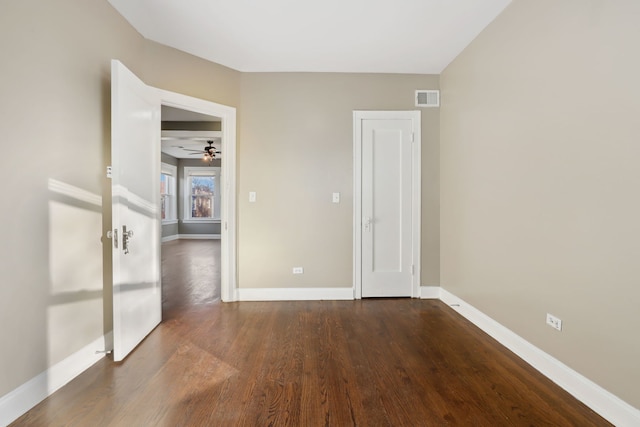 unfurnished room featuring hardwood / wood-style flooring and ceiling fan