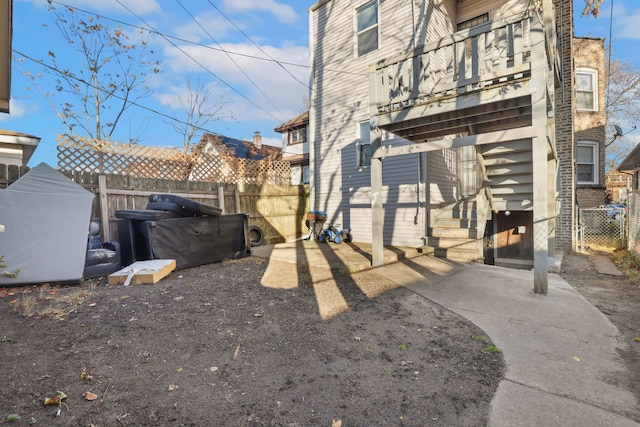 rear view of property featuring a balcony