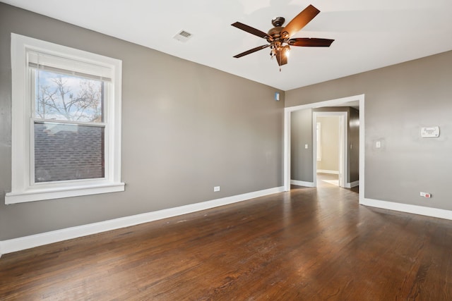 unfurnished room featuring ceiling fan and dark hardwood / wood-style floors