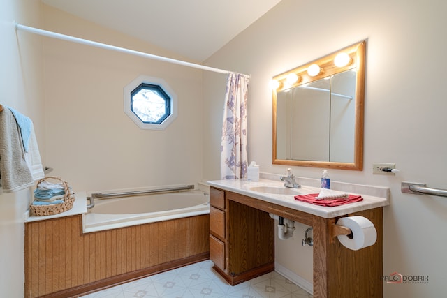 bathroom with vaulted ceiling and sink