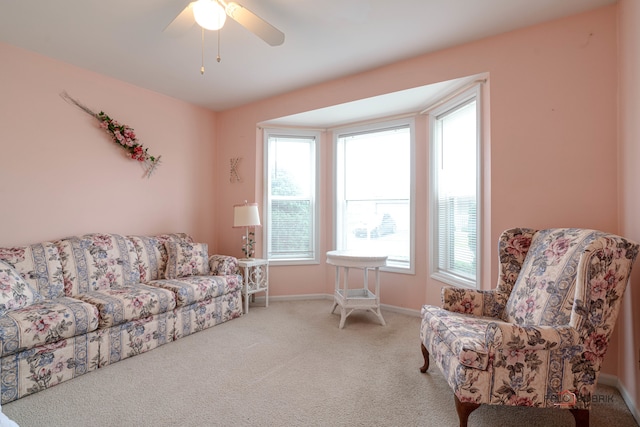 living room featuring ceiling fan and carpet floors