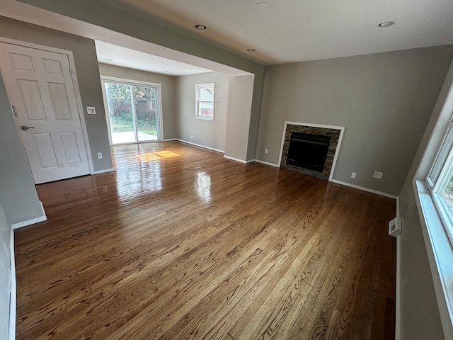 unfurnished living room with hardwood / wood-style flooring