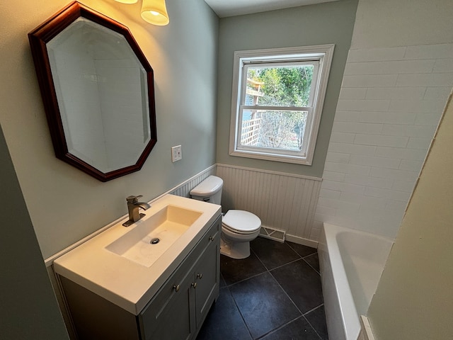 full bathroom with shower / bathing tub combination, tile patterned floors, vanity, and toilet