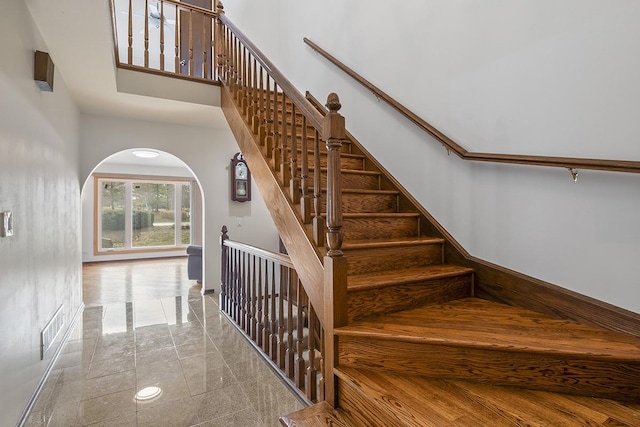 stairs with a towering ceiling