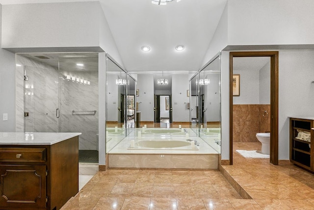 full bathroom with vanity, separate shower and tub, tile patterned flooring, toilet, and lofted ceiling