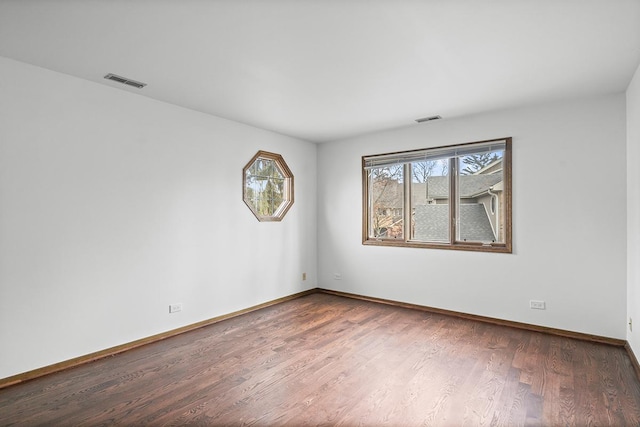 unfurnished room featuring hardwood / wood-style floors