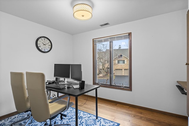 office space with hardwood / wood-style flooring