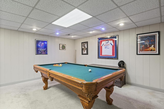 game room with carpet, a drop ceiling, wood walls, and billiards