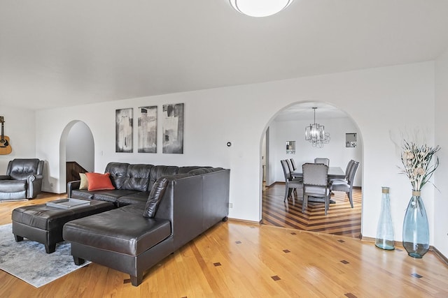 living room featuring hardwood / wood-style floors and a chandelier