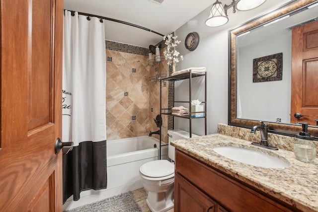 full bathroom featuring tile patterned floors, vanity, toilet, and shower / bath combo with shower curtain