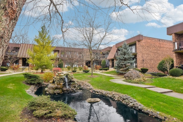 view of home's community featuring a lawn