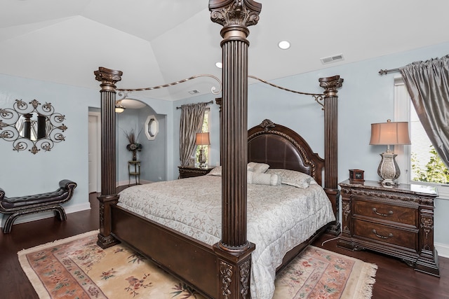 bedroom featuring dark hardwood / wood-style flooring and vaulted ceiling