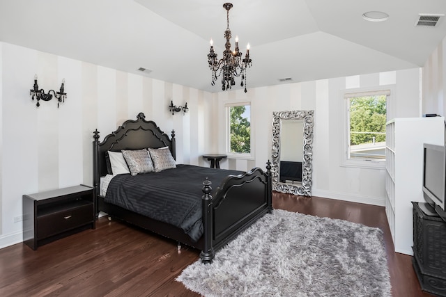 bedroom featuring vaulted ceiling, multiple windows, dark wood-type flooring, and a notable chandelier