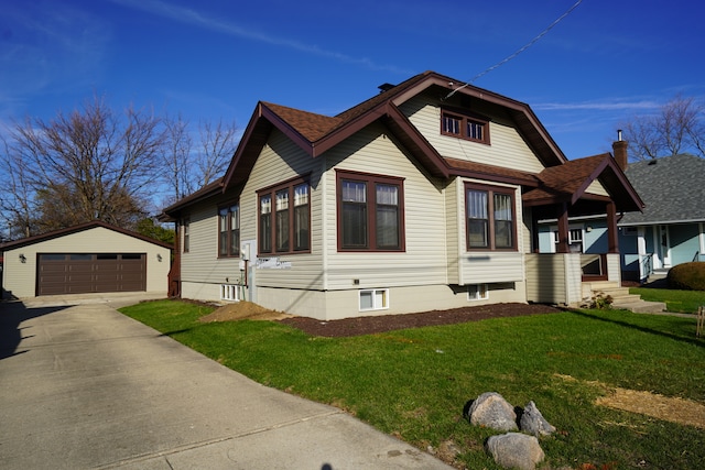 view of home's exterior with a yard, an outbuilding, and a garage