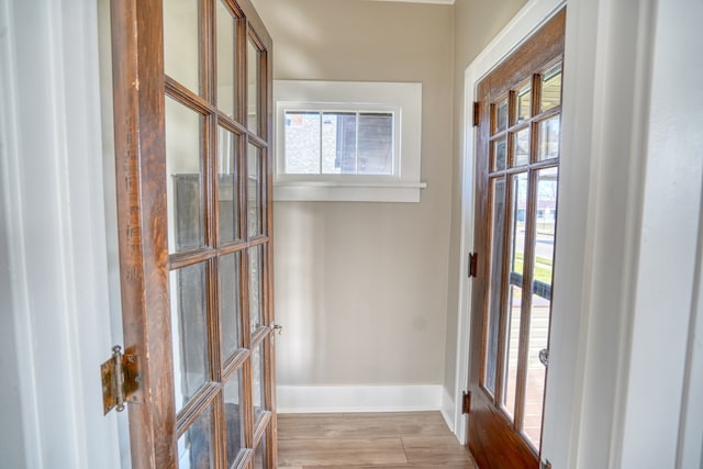 doorway featuring french doors and light hardwood / wood-style floors