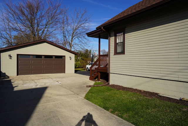 view of property exterior with an outdoor structure and a garage