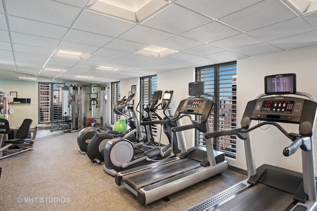 workout area featuring a paneled ceiling