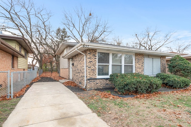 937 E 148th St, Dolton, IL 60419 - view of side of home with brick siding and driveway