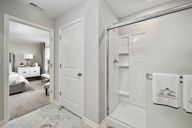 bathroom featuring a shower with shower door