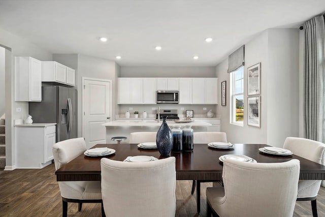 dining room with dark hardwood / wood-style flooring