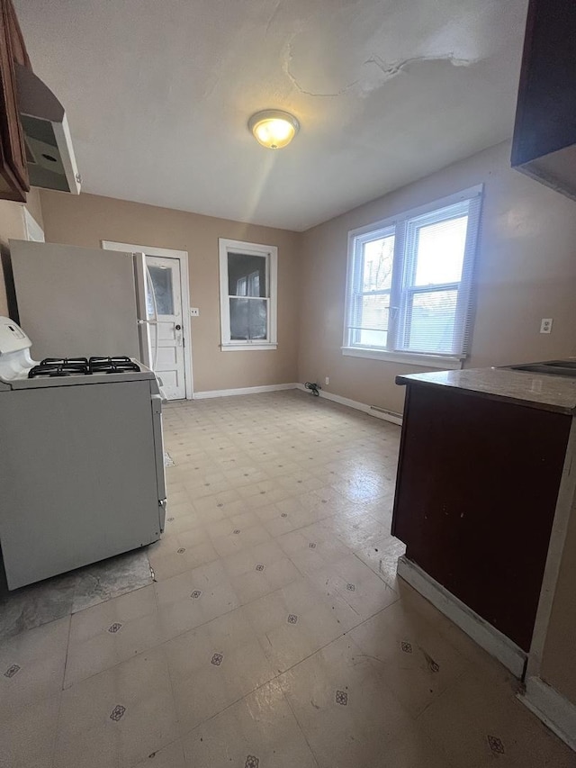 kitchen featuring white refrigerator and range