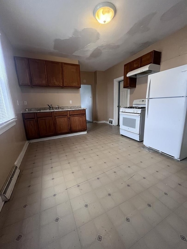 kitchen with white appliances, a baseboard radiator, and sink