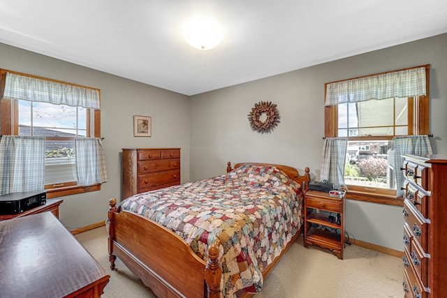 bedroom with light colored carpet